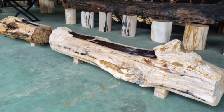 person carefully cleaning a petrified wood table surface with gentle cloth